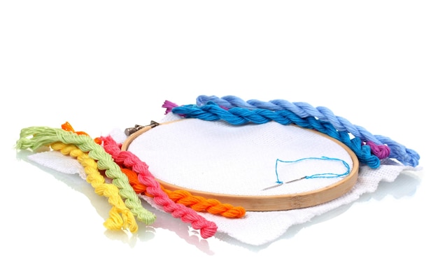 Hands stitching colorful embroidery hoop